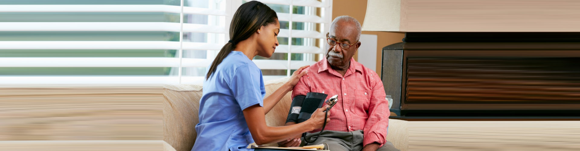 caregiver checking a senior man